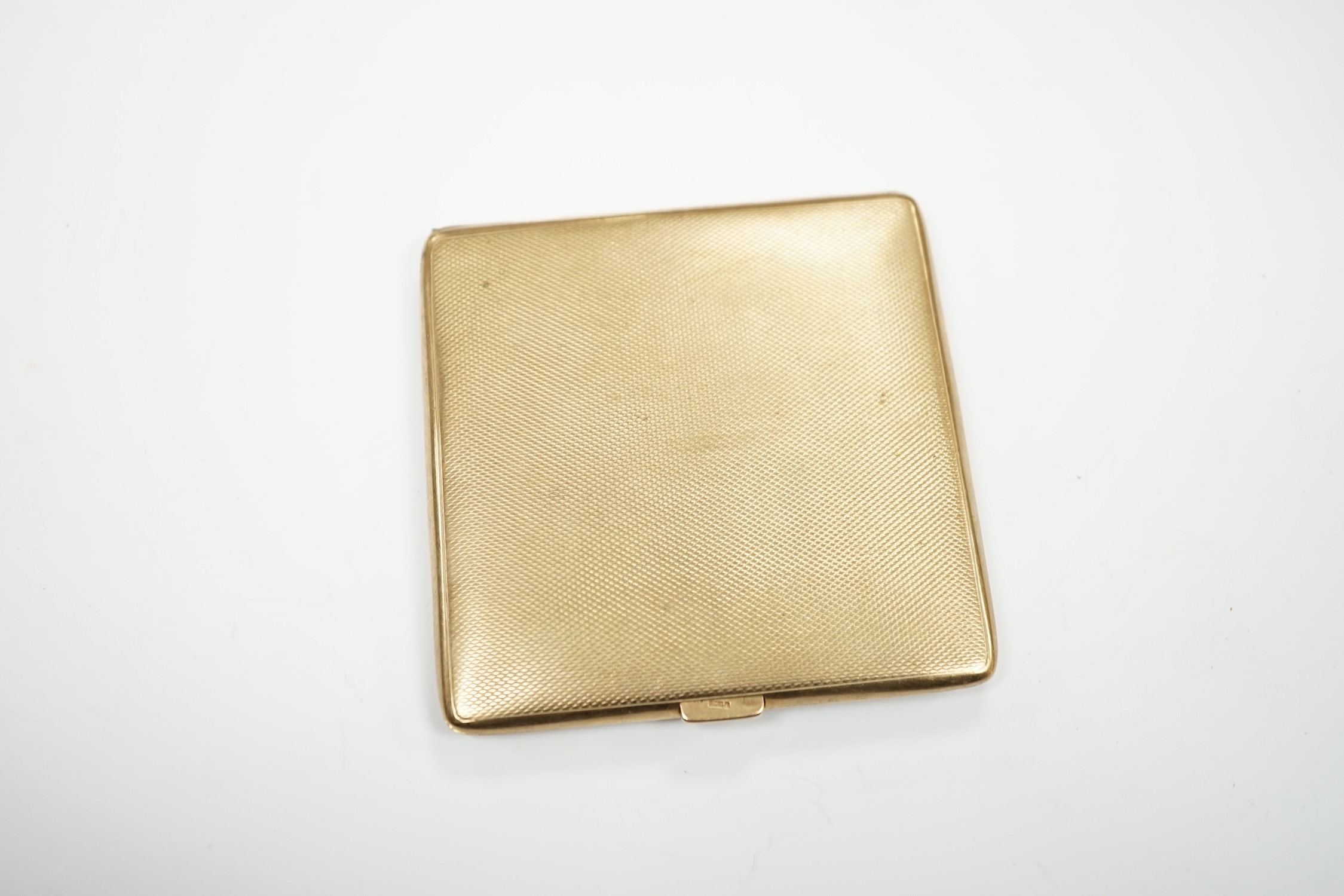A George V square engine turned 9ct gold cigarette case by S. Blanckensee & Sons Ltd., Birmingham, 1928, 85MM, gross weight 106 grams.